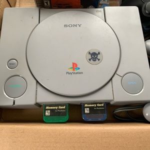 Play Station Cosole and Two Controllers